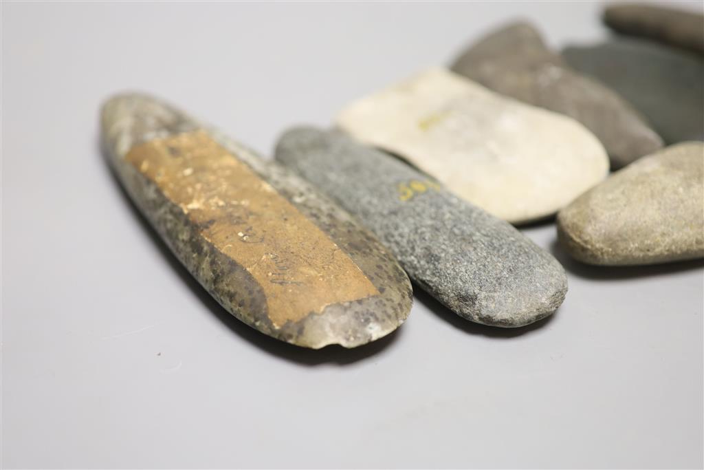 A group of stone adze hand tools, three 19th century Papua New Guinea, each labelled New Guinea, collected before 1950,